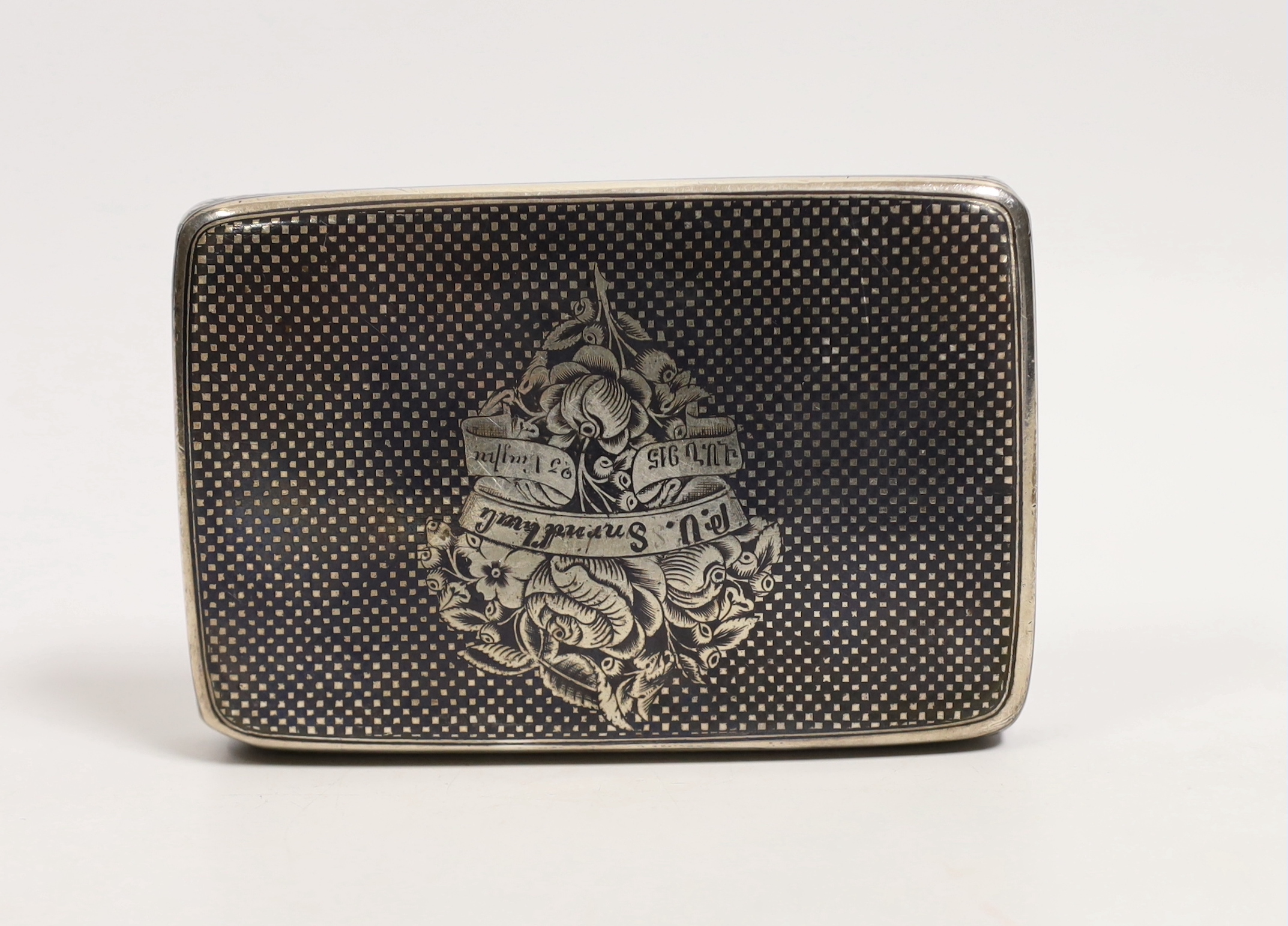 A 19th century Russian? white metal and niello rectangular snuff box, decorated with a pensive figure in a landscape with script, unmarked, 97mm, 119 grams.